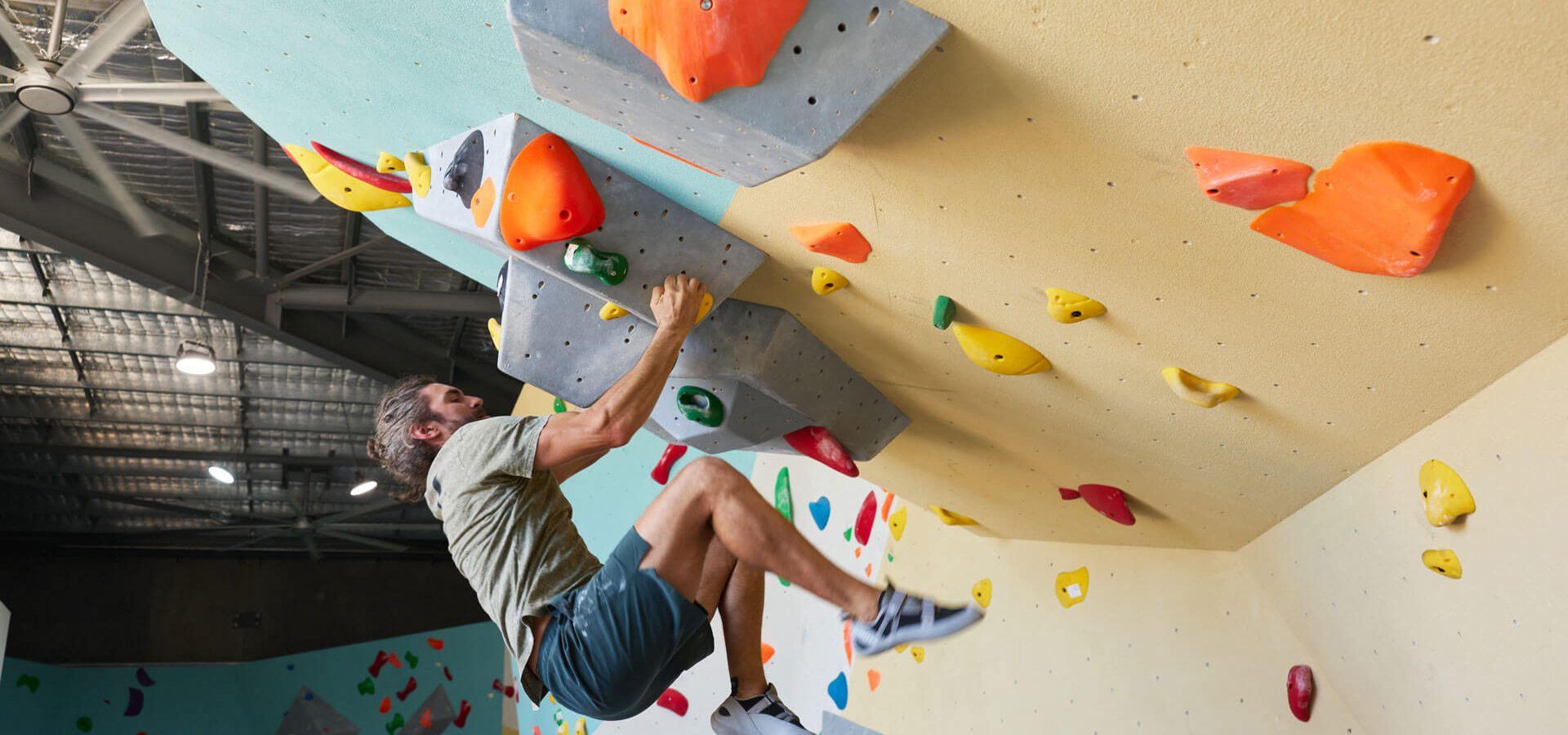 Climbers bouldering above the safety matting at Ascend Bouldering