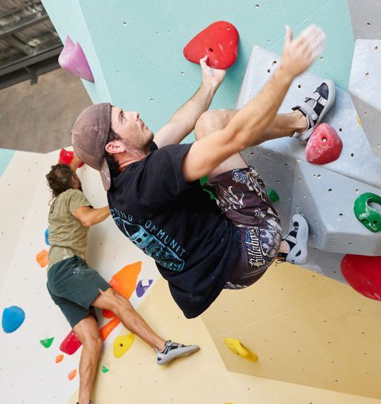 Climber on the volume wall at Ascend Bouldering, Coffs Harbour